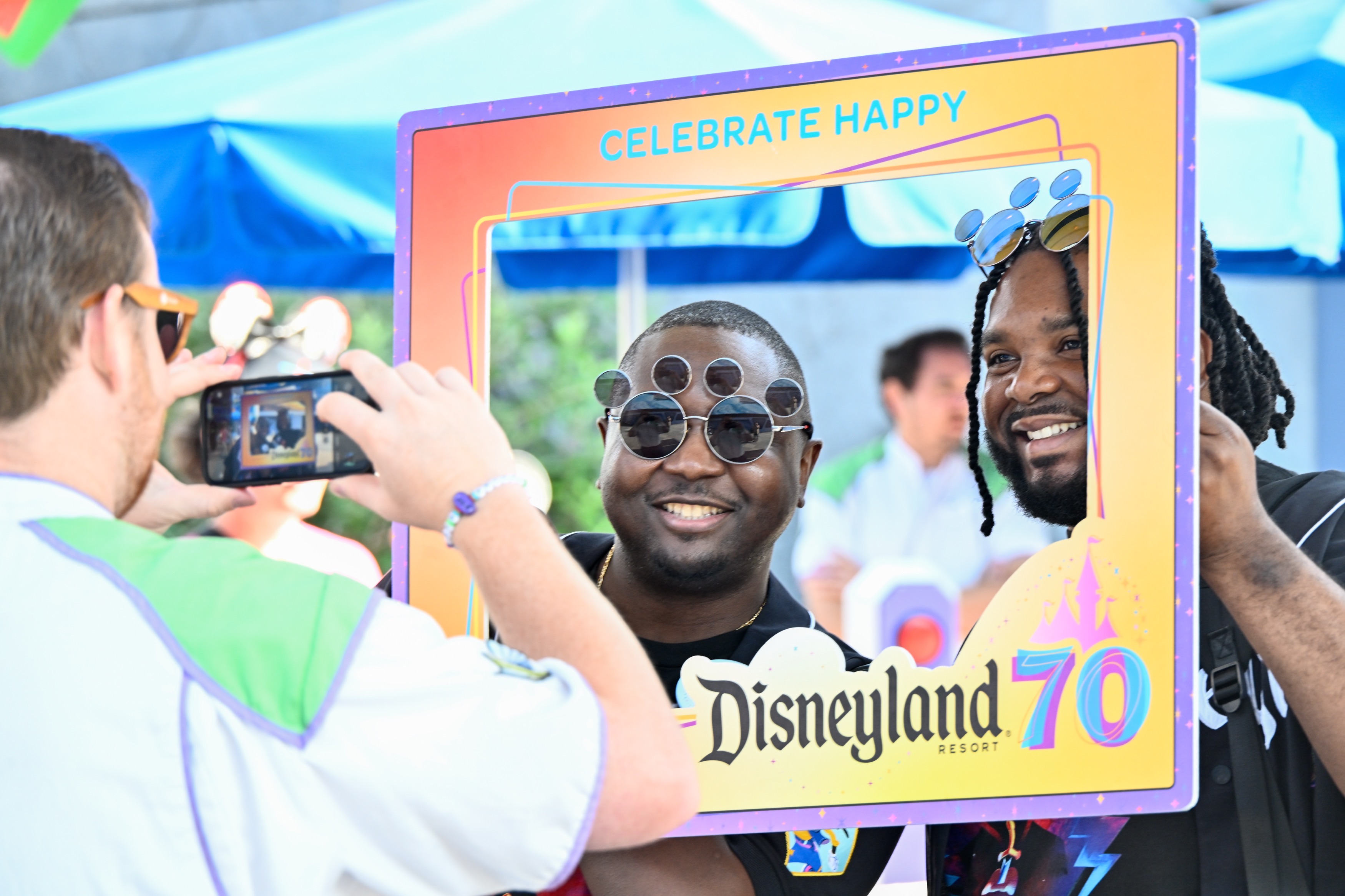 Kevin drayton, left, and Ashton Johnson take a picture in a frame during the 70th anniversary Disneyland on July 17, 2025, ￼ in Anaheim, CA. ￼ (Photo by Jeff Gritchen, Orange County Register/SCNG)
